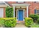 A blue front door framed by green landscaping at 3168 Kirkwood Nw Dr, Kennesaw, GA 30144