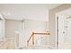 Hallway area shows hardwood floors, white railing, and doors leading to other rooms, including a bathroom at 3168 Kirkwood Nw Dr, Kennesaw, GA 30144