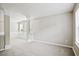 An airy, bright living area with neutral carpeting and large windows at 3168 Kirkwood Nw Dr, Kennesaw, GA 30144