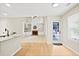 Open concept living room with view of the kitchen and outdoor patio at 3168 Kirkwood Nw Dr, Kennesaw, GA 30144
