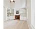 Bright living room with fireplace, built-in shelving, and abundant natural light at 3168 Kirkwood Nw Dr, Kennesaw, GA 30144