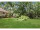 Expansive backyard featuring lush lawn and mature trees for privacy and outdoor enjoyment at 3820 Pheasant Run Trce, Cumming, GA 30028