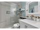 Modern bathroom featuring a glass-enclosed shower, a white vanity, and neutral tile at 3820 Pheasant Run Trce, Cumming, GA 30028