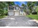 Charming two-story home with a well-manicured lawn, a blue front door, and a two-car garage at 3820 Pheasant Run Trce, Cumming, GA 30028