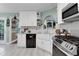 Bright kitchen featuring white cabinetry, granite countertops, stainless steel appliances, and a farmhouse sink at 3820 Pheasant Run Trce, Cumming, GA 30028