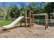 Neighborhood playground with slide, monkey bars and basketball hoop for community fun at 3820 Pheasant Run Trce, Cumming, GA 30028