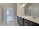Bathroom featuring a double vanity, and a separate shower and toilet area at 406 Westmarch Cir, Loganville, GA 30052