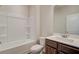 Bathroom with tub, toilet and sink with cabinet at 406 Westmarch Cir, Loganville, GA 30052
