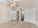 Spacious bedroom with wood-look floors, ceiling fan, and closets/storage at 4234 Stillwater Dr, Duluth, GA 30096