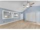 A spacious bedroom with a large window, closet, and wood-look floors at 4234 Stillwater Dr, Duluth, GA 30096