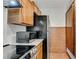 Kitchen area with stainless steel appliances, granite countertops, and light wood cabinets at 4234 Stillwater Dr, Duluth, GA 30096
