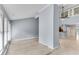 Spacious living room with hardwood floors, connecting the kitchen, staircase, and multiple windows at 4234 Stillwater Dr, Duluth, GA 30096