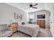 Bright bedroom with a bed, gray chair, and decor at 141 Alaina Rd, Canton, GA 30115