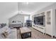 Cozy upstairs bonus room with a bed, entertainment center, and space for a desk at 141 Alaina Rd, Canton, GA 30115