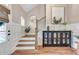 Welcoming entryway with hardwood floors, staircase, and decorative accents at 141 Alaina Rd, Canton, GA 30115