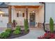 Charming front porch with stylish decor and a welcoming bench at 141 Alaina Rd, Canton, GA 30115