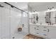 Sleek main bathroom featuring a glass shower and double vanity sinks at 141 Alaina Rd, Canton, GA 30115