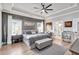 Spacious main bedroom features neutral decor, tray ceilings, and plenty of natural light at 141 Alaina Rd, Canton, GA 30115