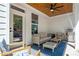 Inviting covered patio featuring stylish furniture, a ceiling fan, and stainless steel grill at 141 Alaina Rd, Canton, GA 30115