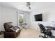 Bedroom with comfortable furniture, including a recliner and desk, providing a versatile and functional space at 2033 Millstream Holw, Conyers, GA 30012