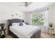 Cozy bedroom with a plush upholstered bed, natural light from the window, and stylish decor at 2033 Millstream Holw, Conyers, GA 30012