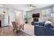 Comfortable living room with modern decor, stainless steel fridge, and lots of natural light at 2033 Millstream Holw, Conyers, GA 30012