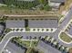 Overhead view showcases the townhome community's design, including parking, landscaping, and road layout at 387 Skylar Se Way, Atlanta, GA 30315