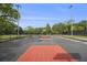 Well-maintained basketball court featuring painted lines and hoops, suitable for recreational games and training at 387 Skylar Se Way, Atlanta, GA 30315