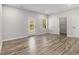 A spacious bedroom features a door to the outside, a closet, and ample natural light at 387 Skylar Se Way, Atlanta, GA 30315
