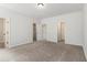 Bright bedroom with carpeted floors and two closets for ample storage at 387 Skylar Se Way, Atlanta, GA 30315