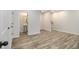A hallway showing an open view to the staircase and a bathroom with sink and toilet at 387 Skylar Se Way, Atlanta, GA 30315