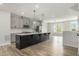 Island kitchen with grey cabinets, stainless appliances and quartz countertops at 387 Skylar Se Way, Atlanta, GA 30315
