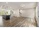 Open living space with a center island with bar seating and plentiful natural light at 387 Skylar Se Way, Atlanta, GA 30315