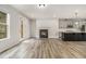 Spacious living room featuring a fireplace, hardwood floors, and ample natural light at 387 Skylar Se Way, Atlanta, GA 30315
