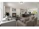 Open-concept living room with fireplace that flows into the modern kitchen and dining area at 387 Skylar Se Way, Atlanta, GA 30315