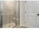 Glass enclosed shower with tile surround and built-in bench at 387 Skylar Se Way, Atlanta, GA 30315