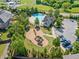 Aerial view of playground and pool surrounded by green space in a residential area at 408 Honeybee Ln, Canton, GA 30115