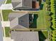 Aerial view of the property showing the roof, backyard, and surrounding landscape at 408 Honeybee Ln, Canton, GA 30115