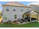 Beautiful backyard with well-maintained lawn, outdoor patio, and covered seating area at 408 Honeybee Ln, Canton, GA 30115