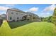 Spacious, lush backyard featuring green grass and mature trees offering serene outdoor space at 408 Honeybee Ln, Canton, GA 30115