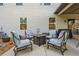 Cozy patio featuring a central fire pit surrounded by comfortable seating and decor at 408 Honeybee Ln, Canton, GA 30115