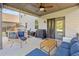 Covered patio with ceiling fan offers cozy outdoor lounging space for Gathering and friends at 408 Honeybee Ln, Canton, GA 30115