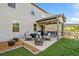 Outdoor patio with modern furniture and seating, perfect for entertaining guests at 408 Honeybee Ln, Canton, GA 30115