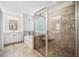 This bathroom features a large glass shower, a soaking tub, and vanity at 408 Honeybee Ln, Canton, GA 30115