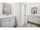 Bright bathroom featuring double vanity and sink with white cabinets at 408 Honeybee Ln, Canton, GA 30115