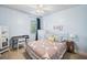 Serene bedroom with a decorative bed, study area, and ample natural light at 408 Honeybee Ln, Canton, GA 30115