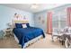 Bedroom with blue walls, carpet, window, and chair at 408 Honeybee Ln, Canton, GA 30115