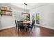 Cozy breakfast nook with natural light, a round table, and black chairs adjacent to a sliding door at 408 Honeybee Ln, Canton, GA 30115