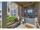 Inviting front entrance with decorative door, stone accents, and landscaped details at 408 Honeybee Ln, Canton, GA 30115