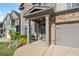 Welcoming front porch with stone accents, decorative columns, and a charming entrance to the home at 408 Honeybee Ln, Canton, GA 30115